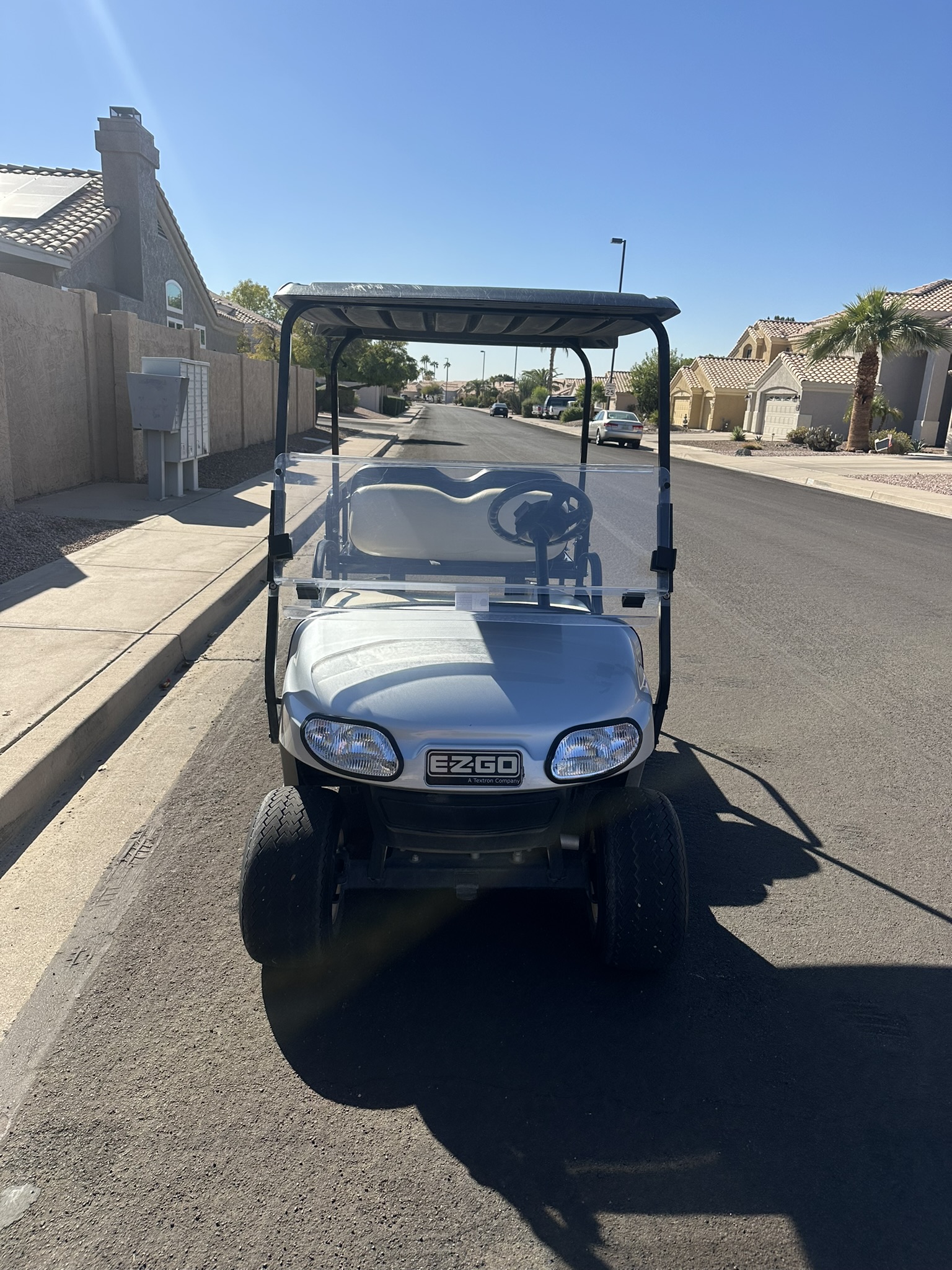 Front view of a four-seater golf cart
